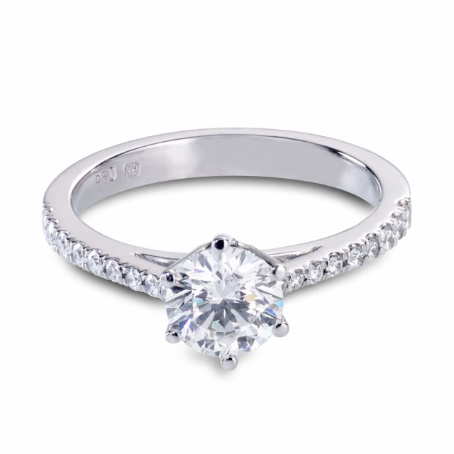 Brilliant cut diamond ring in platinum with smaller diamonds