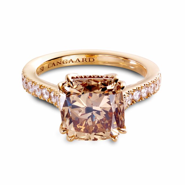 5.07 ct. champagne colored diamond ring in rose gold with white diamonds.