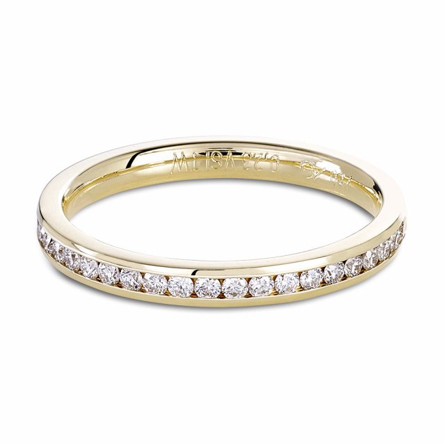 Channel set brilliant cut white diamond ring in yellow gold